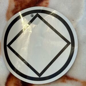 Official service symbol for Narcotics Anonymous (NA).